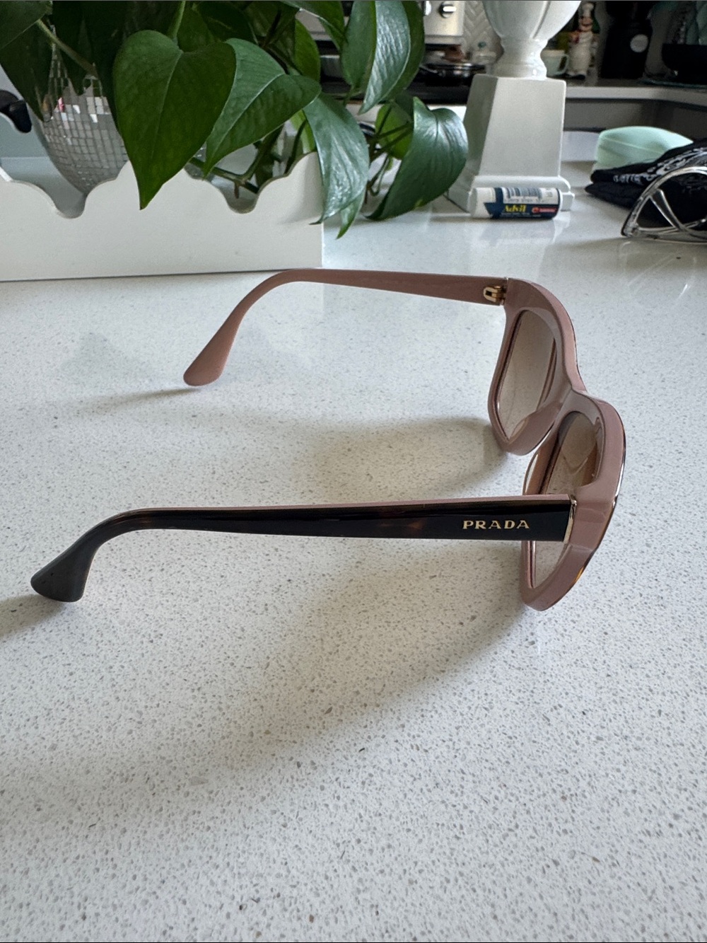 Prada Pink Frame Sunglasses with Black Temples